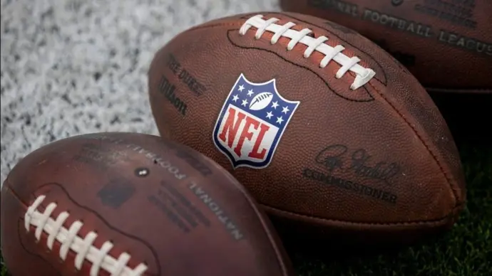 NLF footballs are displayed before an NFL football game between the Los Angeles Rams and the Seattle Seahawks at SoFi Stadium Sunday Nov. 16^ 2025^ in Inglewood^ Calif.