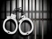 wpid-arrest-7-handcuffs-on-left-with-cell-bars-jpg-23