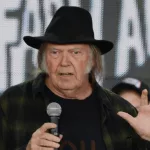 Neil Young talks onstage at the 2018 Farm Aid press conference. Hartford^ CT - September 22^ 2018