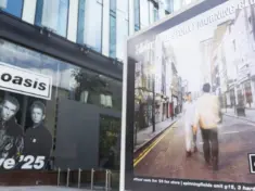 Oasis album cover artwork on display outside the Oasis live 25 shop in Manchester Manchester^ UK - 26 June 2025