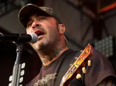 Aaron Lewis plays his guitar druing the performance of Staind Rockstar Uproar Festival on September 25^ 2012 in Nampa^ Idaho.