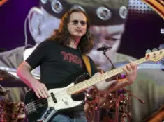 Geddy Lee of the rock band Rush hits the stage for part of their Time Machine Tour at the Gibson Amphitheater in Universal City^ CA on June 22^ 2011.