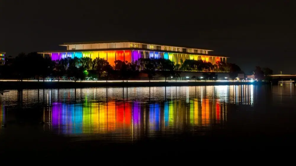 shutterstock_1564971187764522 The Kennedy Center illuminated in a rainbow of colors in recognition of the upcoming Kennedy Center Honors. Washington^ DC / USA - November 19^ 2019