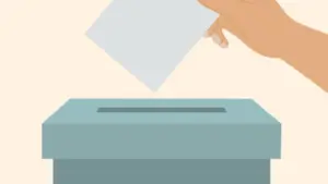 voting-concept-with-ballot-box-and-human-hand-holding-voting-paper