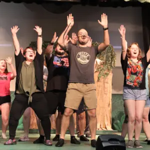 Cast members of “Shrek the Musical” perform a musical number during a rehearsal Monday, June 15 at the Lyric Theatre.
