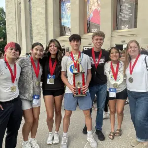 Early High School Future Problem Solving team members (from left) John Gowin, Riley Powell, Abby Rico, Matthew Walker, A.J. Tidwell, Lexi Rodriquez and Brooklyn Guthery are pictured with their third-place trophy and medals at Indiana University.