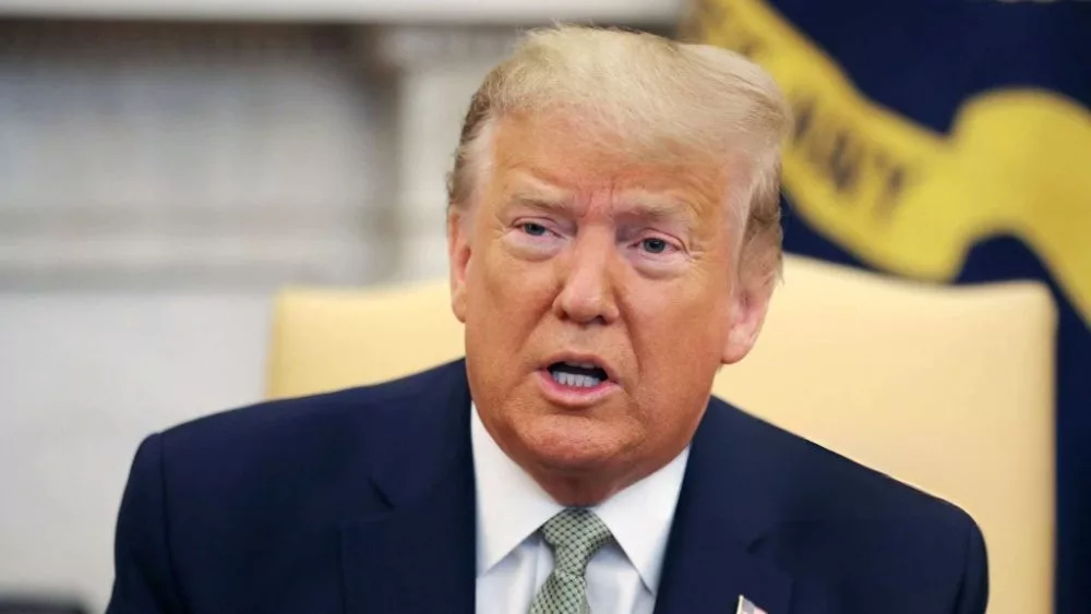 President Donald Trump talks to journalists at the Oval Office at the White House March 12^ 2020 in Washington^ DC.