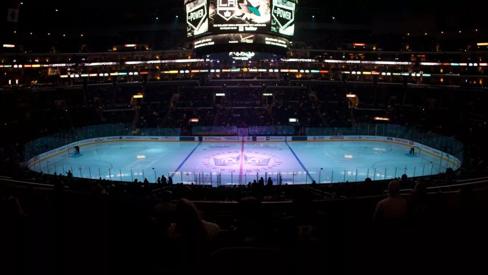 pro ice hokey rink lit up at nighttime