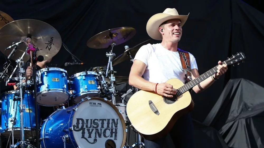 Dustin Lynch performs during the 'Kick The Dust Up' Tour at Vanderbilt Stadium on July 11^ 2015 in Nashville^ Tennessee.