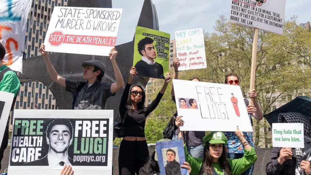Activists gathered in front of Federal Court where Luigi Mangione was arraigned on Federal Charges accusing him of killing United HealthCare CEO Brian Thompson New York - April 25^ 2025