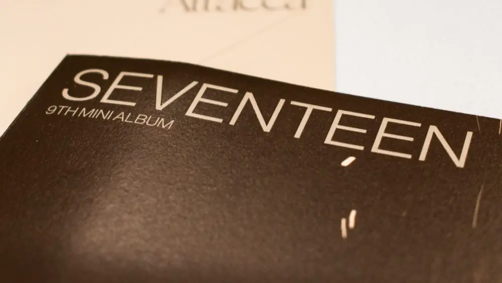 Seventeen's 9th Mini Album^ "Attacca"was released in 2021. Seventeen is a South Korean K-Pop group -Album cover pictured.