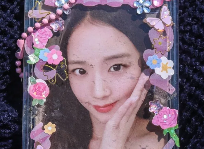 Photocard of girl group singer Kim Ji Soo or Jisoo of Blackpink. photocard of Jisoo blackpink isolated on blue background.