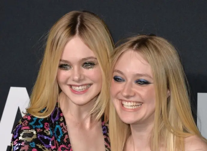 Elle Fanning & Dakota Fanning arriving at the Saint Laurent at the Palladium fashion show at the Hollywood Palladium. LOS ANGELES^ CA - FEBRUARY 10^ 2016