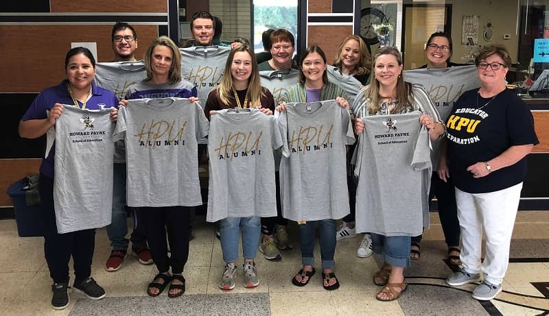 alumni-educators-with-shirts-photo