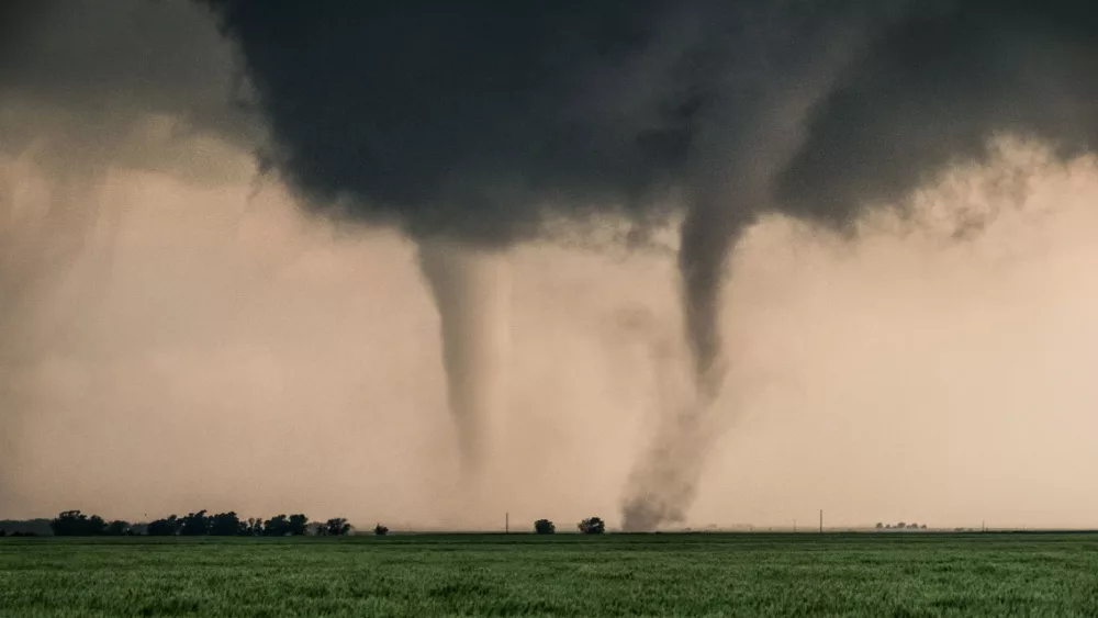 A pair of tornadoes take a destructive path through northern Oklahoma farmyards near Cherokee