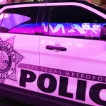 Patrol car of the Las Vegas Metropolitan Police Department parked under the neon lights of Las Vegas Boulevard. LAS VEGAS^ NEVADA^ USA - FEBRUARY 2019