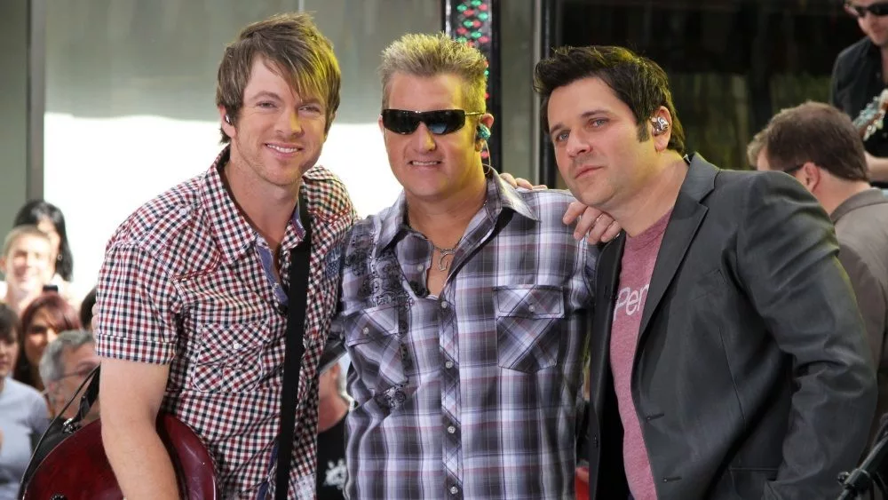 Guitarist Joe Don Rooney^ singer Gary Levox and bassist Jay DeMarcus of Rascal Flatts perform on NBC's Today Show in Rockefeller Plaza on June 11^ 2010 in New York City.