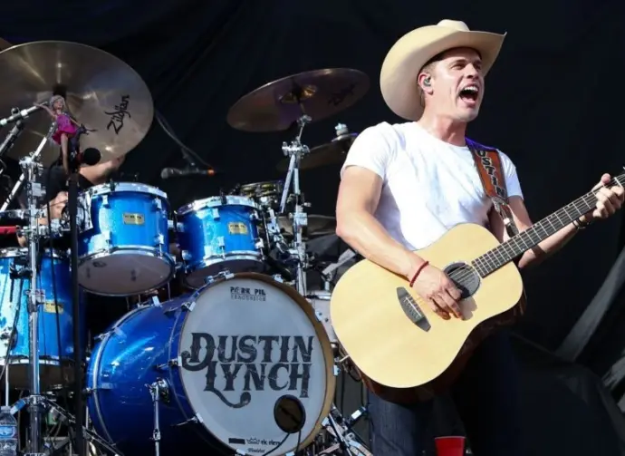Dustin Lynch performs during the 'Kick The Dust Up' Tour at Vanderbilt Stadium on July 11^ 2015 in Nashville^ Tennessee.