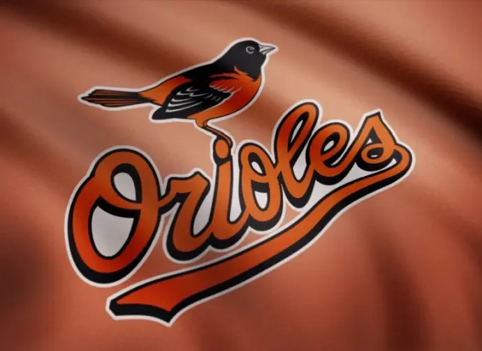 WAVING flag with Baltimore Orioles professional team logo. Close-up of waving flag with Baltimore Orioles MLB baseball team logo^ seamless loop.