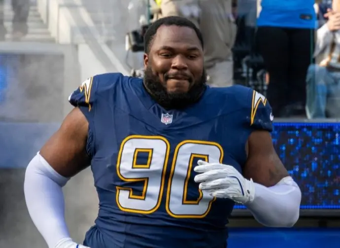 Los Angeles Chargers defensive lineman Teair Tart #90 runs into field before an NFL football game against the Houston Texans at SoFi Stadium^ Saturday Dec. 27^ 2025^ in Inglewood^ Calif.