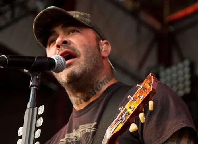 Aaron Lewis plays his guitar druing the performance of Staind Rockstar Uproar Festival on September 25^ 2012 in Nampa^ Idaho.