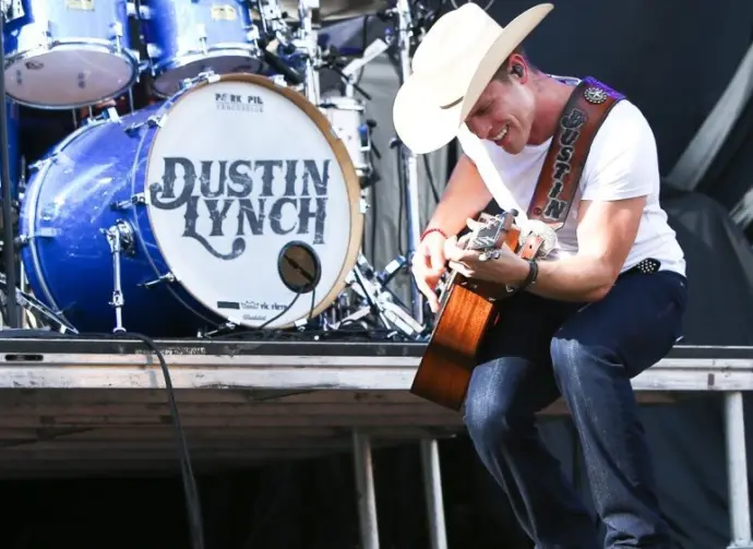 Dustin Lynch performs during the 'Kick The Dust Up' Tour at Vanderbilt Stadium on July 11^ 2015 in Nashville^ Tennessee.