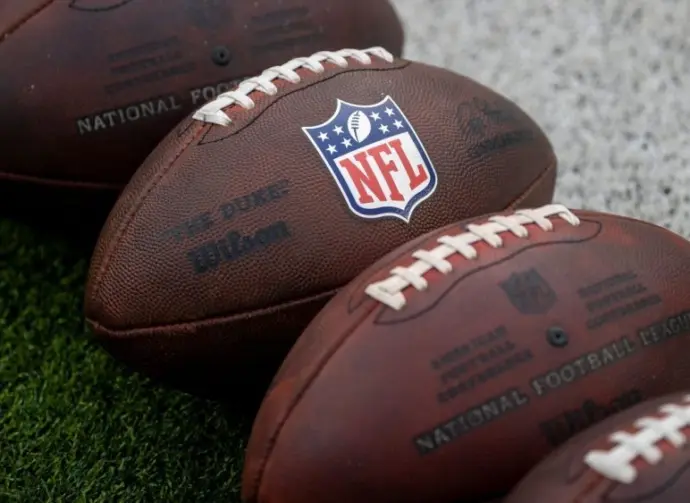 NLF footballs are displayed before an NFL football game between the Los Angeles Rams and the Seattle Seahawks at SoFi Stadium Sunday Nov. 16^ 2025^ in Inglewood^ Calif.