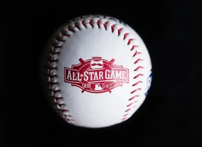 Close up baseball printed with logo for the 2015 Major League Baseball All-Star Game isolated on a dark black background. Cincinnati^ Ohio^ USA - July 21 2022