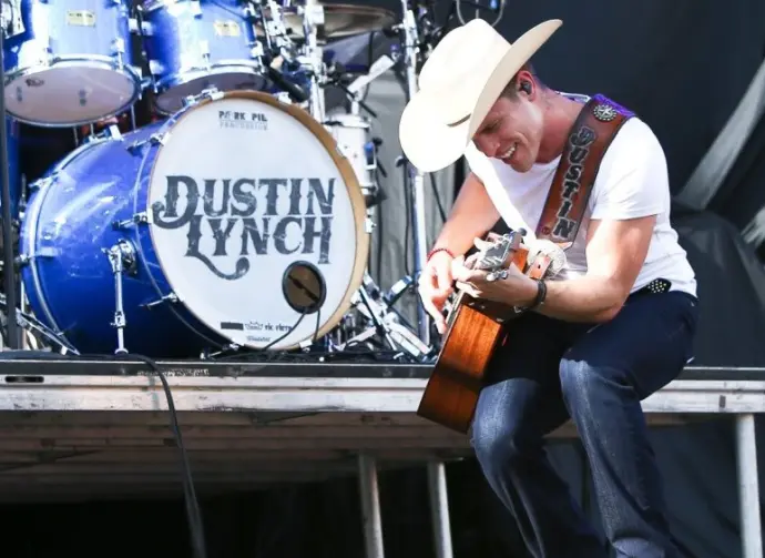 Dustin Lynch performs during the 'Kick The Dust Up' Tour at Vanderbilt Stadium on July 11^ 2015 in Nashville^ Tennessee.