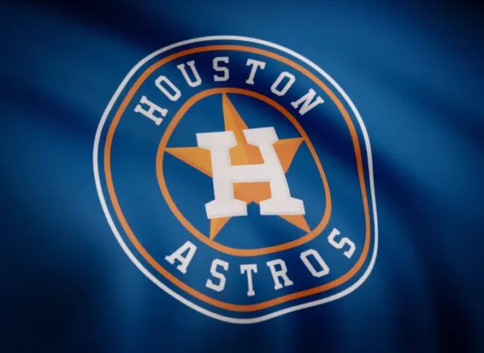 Waving flag with Houston Astros professional team logo. Close-up of waving flag with Houston Astros baseball team logo^ seamless loop. Editorial footage