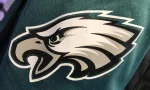 Closeup of the arm/sleeve displaying the official logo on a Philadelphia Eagles jersey
