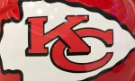 Closeup of Kansas City Chiefs helmet^ white and red^ displaying 'KC' logo