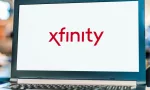 Laptop computer displaying logo of Xfinity^ the trade name of Comcast Cable Communications^ LLC to market consumer cable television^ internet^ telephone.