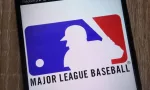 Major League Baseball logo displayed on a modern smartphone