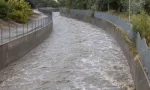 A high Los Angeles River rushes under Sepulveda Boulevard during flash flooding. August 20^2023