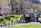 Runners in the Boston Marathon pass the 1 kilometer to go line on their way to the finish line