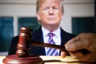 Trump and the court session. The judicial hammer on the background of former president Donald Trump.