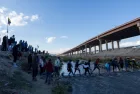 Migrants from Venezuela cross the Rio Grande to surrender to the border patrol with the intention of requesting asylum in the United States.