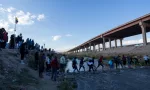 Migrants from Venezuela cross the Rio Grande to surrender to the border patrol with the intention of requesting asylum in the United States.