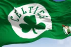 Boston Celtics flag^ waving in the wind on a clear day. American professional basketball team^ Eastern Conference