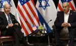 US President Joe Biden (L) listens to Israel's Prime Minister Benjamin Netanyahu as he joins a meeting of the Israeli war cabinet in Tel Aviv on October 18^ 2023