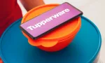 In this photo illustration^ a person carries various plastic products (containers) and a smartphone shows the Tupperware logo