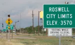 Highway sign for Roswell^ New Mexico