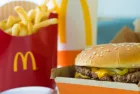 Selective focus on McDonald's Double Quarter Pounder burger with chesse^ french fries potatoes and drink.