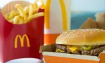 Selective focus on McDonald's Double Quarter Pounder burger with chesse^ french fries potatoes and drink.