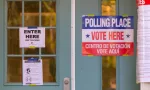 Signs on polling place door during voting on presidential election day in northern Virginia. ARLINGTON^ VIRGINIA^ USA - NOVEMBER 3^ 2020