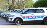 Columbus Ohio May 1^ 2022 A succession of police cars lined up in front of precinct.