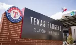 MLB Baseball Texas Rangers' Globe Life Field entrance with flag. Arlington^ TX - March 30^ 2022