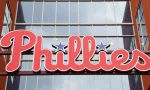 A sign for the MLB Philadelphia Phillies. Philadelphia^ Pennsylvania - April 6^ 2024