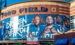 Horizontal^ medium closeup of "Ford Field" Detroit Lions' football field stadium's exterior facade brand and logo signage on a sunny day. Detroit^ MI USA - September 15^ 2021